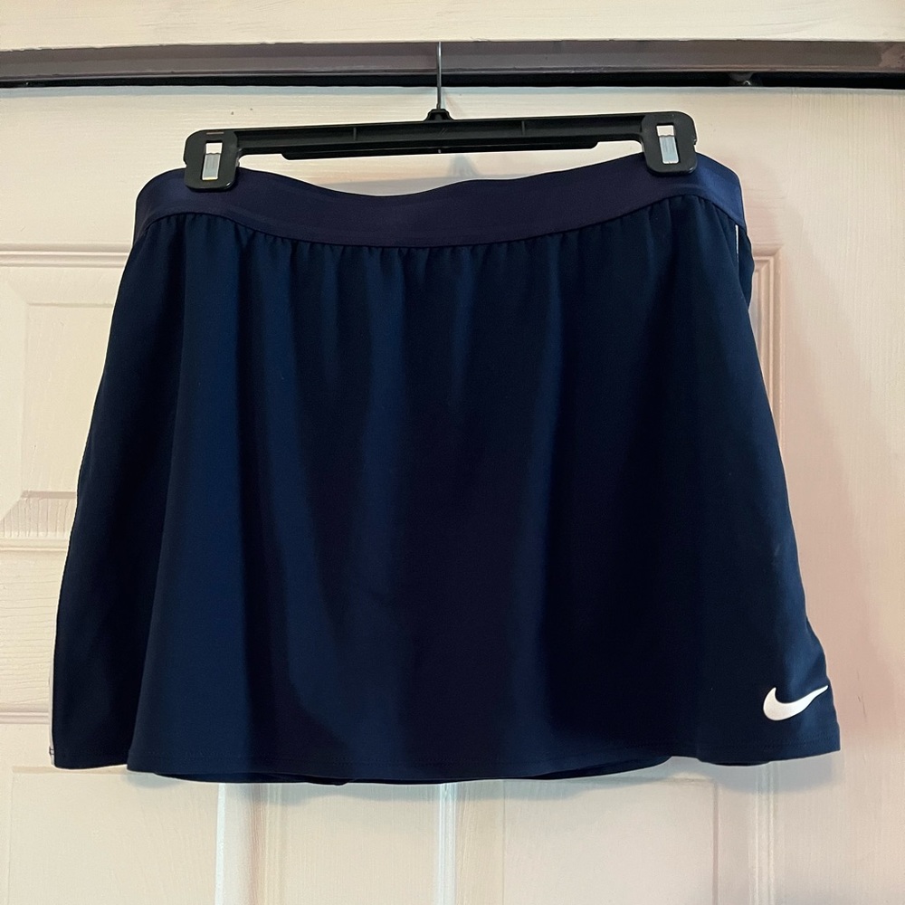 Nike Dri fit tennis skirt with built in shorts. Color navy size xl